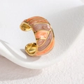 Detailed close-up of golden enamel ring with orange and purple gradient patterns - Orange (OLBR921)