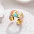 Adjustable gold ring with colorful enamel geometric patterns on a white textured surface - Colorful Patch (OLBR924)