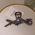 Detailed close-up of gunmetal hair claw with purple pearls on a display card - 12.6cm / Gunmetal