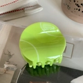 Detailed top view of a fluorescent green tennis-themed hair claw clip with white patterns - Tennis Ball