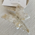 Close-up of cream white butterfly hair claw clip with marble texture and metal spring - Creamy White (11.8CM)