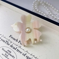 Detail of floral acetate hair claw clip with pearl center and gradient striped petals - Striped Pink Yellow