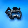 Detailed close-up of a black marble texture dog-shaped acetate hair claw clip - Hair Claw / Dark Grey