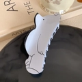 Detailed view of a white polar bear acetate hair claw clip on a decorative tray - 11.5CM / White