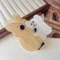 Detailed view of cute acetate koala hair claw clip with marble texture on wood tray - Yellow