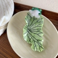 Detail shot of a creative frog and lily pad acetate hair claw clip on a ceramic tray - Frog & Lotus Leaf Design / Large (11.5cm) / Mint Green