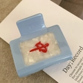 Close-up of blue and white mahjong tile hair clip with red character on soft background - 5cm / Blue