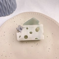 Detailed macro view of hollow cheese claw clip with cute mouse decoration made of acetate - Approx. 8cm / Cyan Cheese