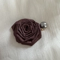 Detail of a large rose-shaped hair claw clip with vintage texture and grey pearl accent - Brown Duckbill Clip