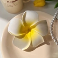 Close-up of realistic white plumeria flower hair clip with yellow gradient detail - Large Plumeria Side Clip (9cm)