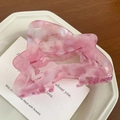 Detailed close-up of pink marble pattern acetate hair claw clip with geometric hollow design - 8cm / Pink
