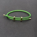 Bracelet ajustable en corde tressée verte avec boucles en métal doré poli et fermoir coulissant - Vert