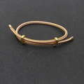 Bracelet réglable en corde tressée rose avec accents métalliques dorés et curseurs - Or Rose