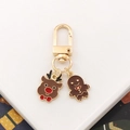 Christmas reindeer and gingerbread man metal keychain with golden lobster clasp festive charm - Reindeer + Gingerbread Man