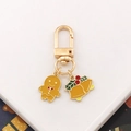 Christmas keychain with gingerbread man and golden bell pendants in colorful enamel finish - Gingerbread Man + Bell