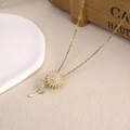 Golden rotating sunflower pendant necklace with zircon micro-pave on a fine chain - Rotating Sunflower Pendant Necklace (NST-0383-Basic)