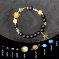 Dettaglio del bracciale sistema solare in pietre naturali e ciondolo dei Pesci - Pesci
