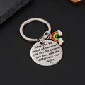 Portachiavi in acciaio lucido con arcobaleno e citazione su sfondo nero lucido - Arcobaleno Tondo
