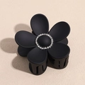 Detail of matte black floral hair claw clip featuring sparkling white rhinestone center - 7.2CM / Black