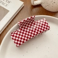 Detail view of red and white checkered square hair claw clip on a white decorative tray - Red White Grid (7.6CM)