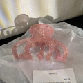 Macro shot of large pink glitter claw clip with sparkling finish for thick hair styling - Pink (9.8cm)