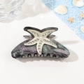Dettaglio della pinza per capelli marmorizzata con stella marina e perle - Grigio Stellato (10.5cm)