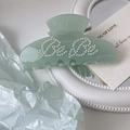 Detail of light green acetic acid hair claw clip with white pearls spelling Bebe - 9.5cm / Light Green