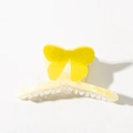 Close-up of yellow butterfly hair claw with pearlescent texture and butterfly text - Bow Claw Clip