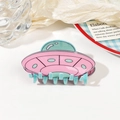 Detail of pink and mint green UFO-shaped acrylic hair claw with shiny finish - 9cm UFO Hair Claw - Pink Green