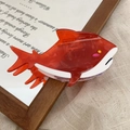 Detailed view of fish-shaped acetate hair claw clip with red and white color blocking - Red / 11cm x 5cm