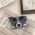 Detail of border collie hair claw clip with black and white marble pattern on textile - Chihuahua