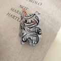 Macro shot of Halloween mummy claw clip with marble texture and orange detail - Bandage Pumpkin