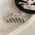 Detail of floral pattern hair claw clip on soft knitted fabric with elegant accessories - Keel Shape / Beige Floral