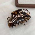 Elegant tortoiseshell hair claw clip with a leopard print bow on a wooden tray - Large Style / Dark Tortoise - Bow Claw Clip