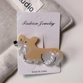 Detail einer süßen Corgi-Haarklammer aus Acetat mit Perlglanz-Oberfläche - Gelb