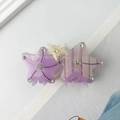Close-up of starfish acetate hair claw with purple marbling and rhinestone accents - Purple Star