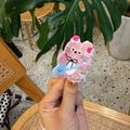 Detail shot of a cute pink cat-shaped acrylic hair claw with blue mini bag decoration - Pearl Pink
