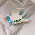 Detailed macro view of acetate bird hair claw clip with blue marble texture on wings - Blue Swallow 8.5cm