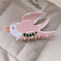 Detailed close-up of bird shaped acetic acid hair claw clip with green leaf patterns - Pink Swallow 8.5cm