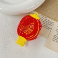 Detailed view of a red lantern claw clip with yellow koi fish pattern and tassel décor - Approx. 9*5cm