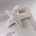 Detailed close-up of a starfish hair claw clip with pearlescent finish and white dots - 4# White Starfish