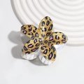 Macro detail of the acrylic leopard print floral hair claw clip with strong spring - Purple Leopard