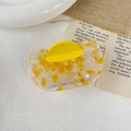 Detailed top view of a yellow marble patterned acetate hair claw clip for elegant styling - Approx. 8.4*5.2cm