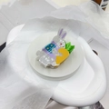 Detailed macro view of cute acrylic rabbit hair claw clip with carrot decoration - Little Rabbit