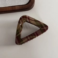 Close-up of a triangular hair claw clip featuring a classic red and green plaid pattern - Light Red Green Plaid - Triangle (Approx 7.8cm)