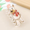Close-up of cute cartoon bear hair claw clip with a pearlescent finish and red polka dot scarf - White Cute Bear
