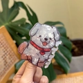 Detail of cute white puppy hair claw clip made of premium marbled acetate material - White Puppy with Red Scarf and Heart