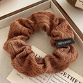Close-up of brown knitted scrunchie showing detailed 100% polyester fabric texture - 10cm / Brown