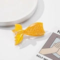 Macro detail of yellow mermaid tail hair claw with acetate fish scale texture - Orange 9.3cm