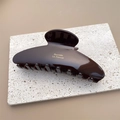 Close-up of deep brown acetate hair claw clip with gold Barrette La France lettering - Black Coffee